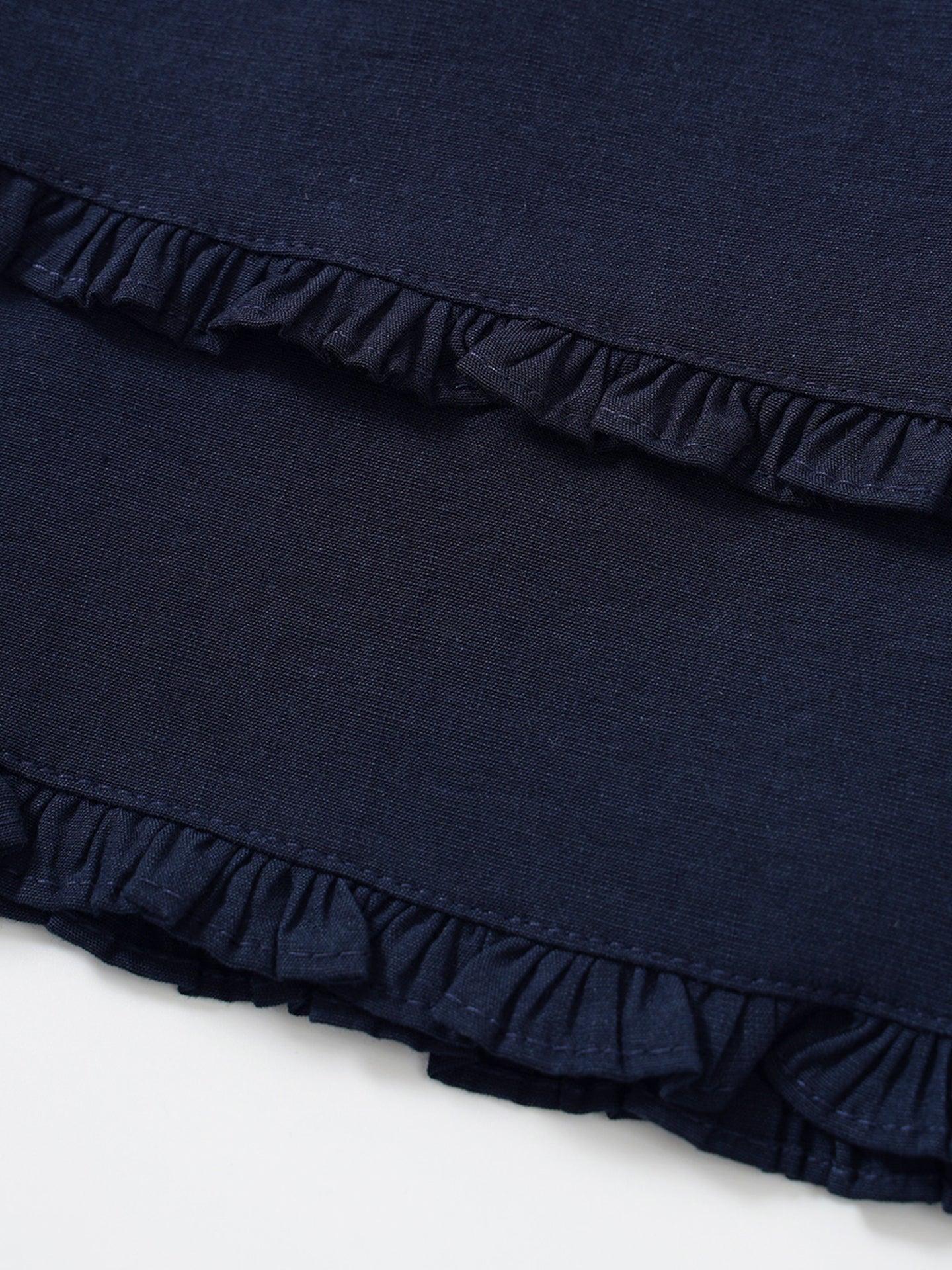 Minifalda azul con volantes, diseño ajustado y talle alto estilo elegante