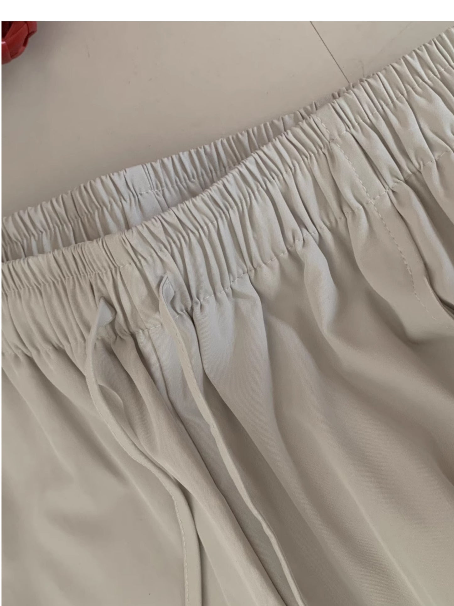 Pantalones sueltos de mujer, corte curvado, cintura alta y pierna recta